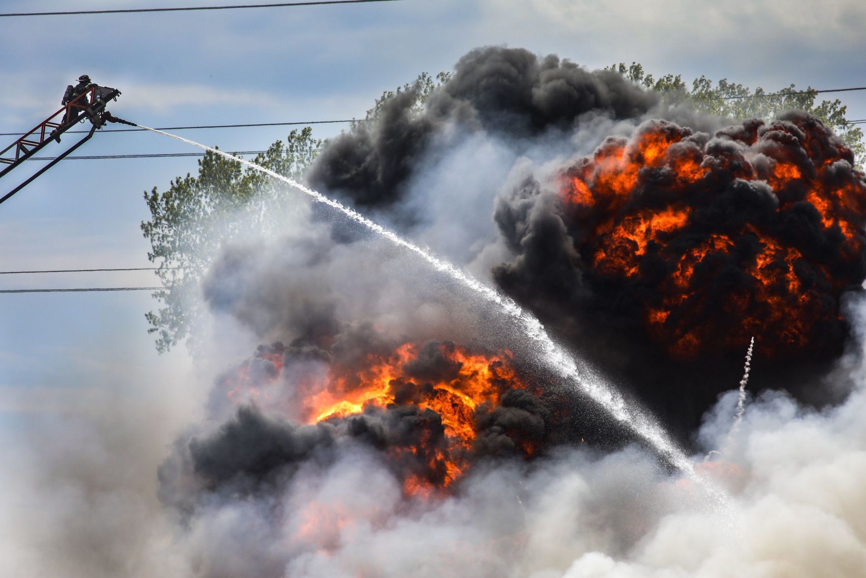 Large fire rolls through warehouse